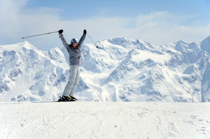 Excited skier throwing her ski poles around - skiing etiquette