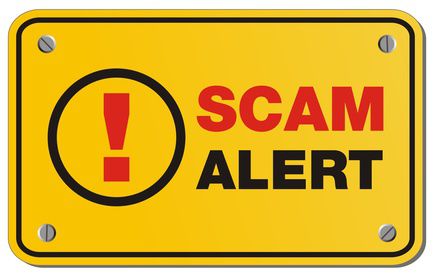 Scam alert sign to depict common travel scams