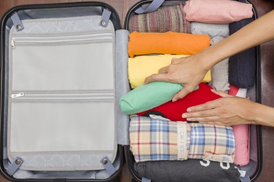 Clothes in one suitcase: Rolling clothes works best!