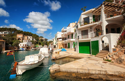 Buying a holiday home - Traditional white spanish villas in Cala Figuera on Mediterranean Sea, Mallorca, Spain