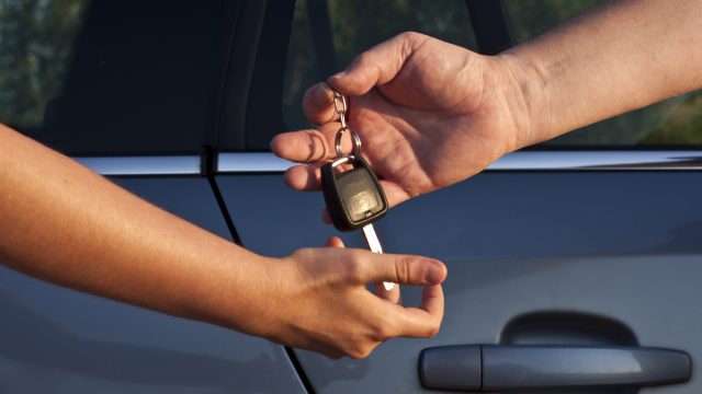 Car keys being handed over