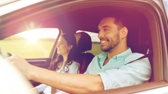 Happy man driving car