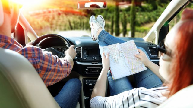 Couple in rental car during a road trip